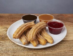 Image of churros with dipping sauces